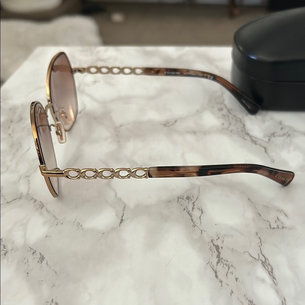 Coach Brown Oval Sunglasses with Gradient Lenses - Picture 3 of 6